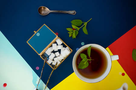 Table setting, tea with mint, teacup and sugarの写真素材