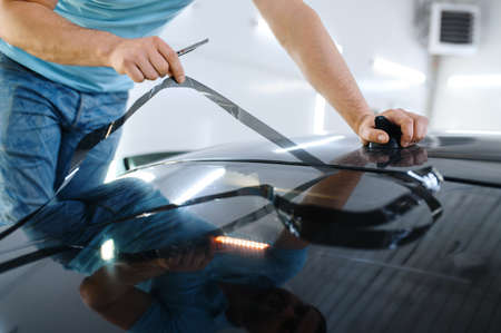 Male wrapper cuts car tinting, tuning serviceの写真素材