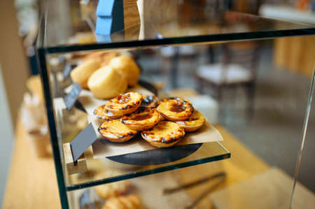 Showcase with cakes, sweets and croissants, cafeの写真素材