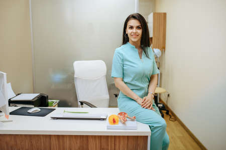 Female gynecologist sitting at the clinic officeの写真素材