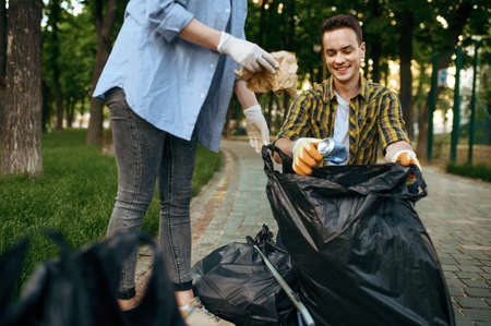 Volunteers picking trash in park, volunteeringの写真素材