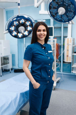 Smiling female surgeon in operating room