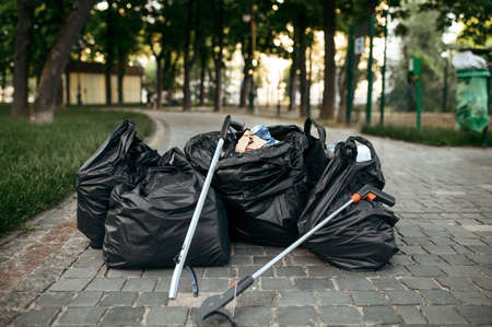 Full trash bags in the parkの写真素材