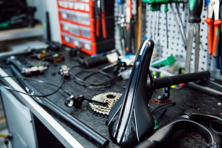 Bicycle workshop, new cycle parts on the tableの写真素材