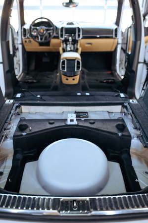 Car interior with removed seats, rear view