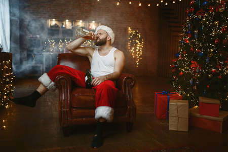 Bad Santa claus drinks alcohol, nasty partyの写真素材
