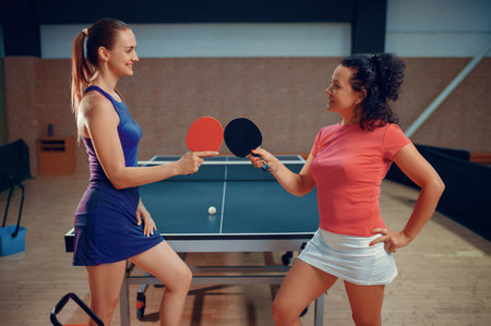 Women holds table tennis rackets, table tennisの写真素材