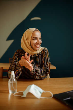 Mask and antiseptic, arab girl on background