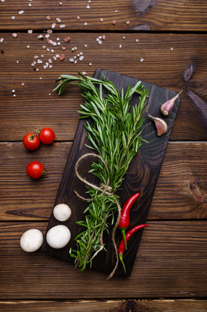 Fresh vegetables on board, wooden backgroundの写真素材