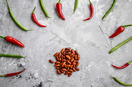 Beans and red pepper isolated on grunge background