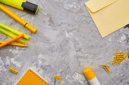Office stationery supplies in yellow tones closeup