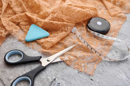 Scissors, chalk and measuring tape closeup