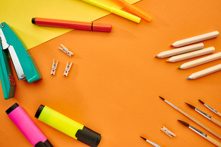 Brushes, markers and stapler closeup, stationeryの写真素材