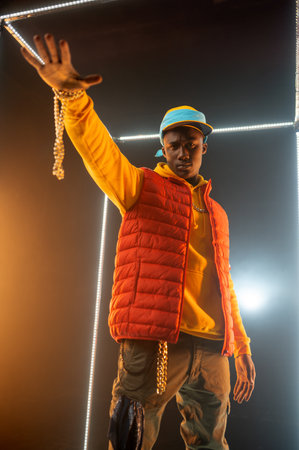 Stylish rapper on the stage with illuminated cubeの写真素材