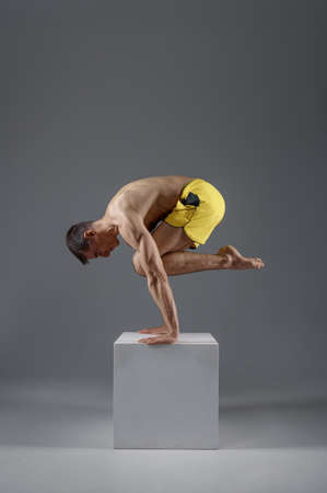 Yoga keeps balanc on hands in difficult pose