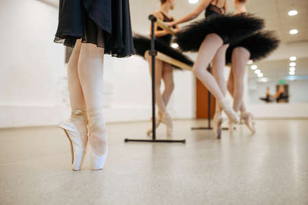 Three young ballerinas, teens rehearsal at barreの写真素材