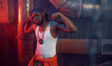 Stylish rapper shows his muscles in studio