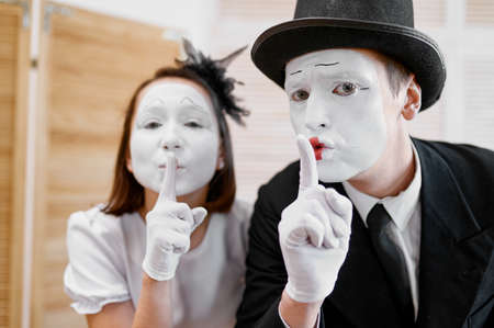 Two mime artists, secret gesture, parody