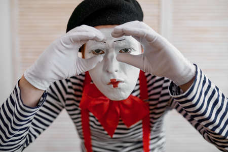 Mime artist, binoculars gesture, parody comedyの写真素材