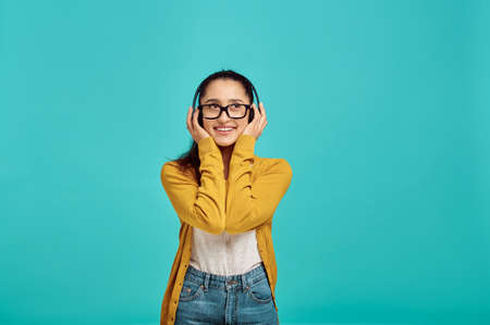 Woman in headphones listens to music, emotionの写真素材