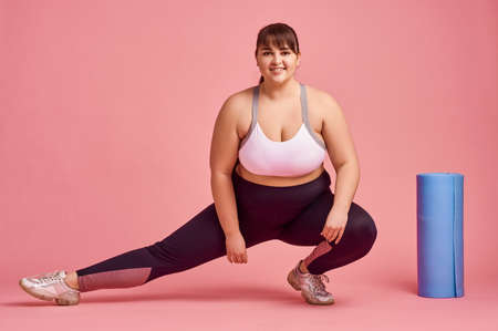 Overweight woman, fitness exercise, body positiveの写真素材