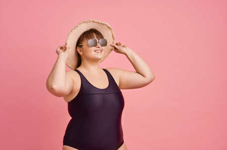 Overweight woman prepares for summer vacationsの写真素材