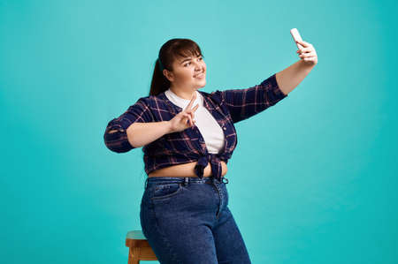 Overweight woman makes selfie, body positiveの写真素材