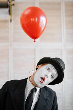Mime artist, strangulation with air balloonの写真素材