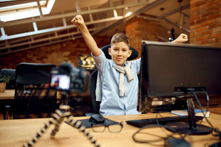 Happy boy recording vlog, little bloggerの写真素材