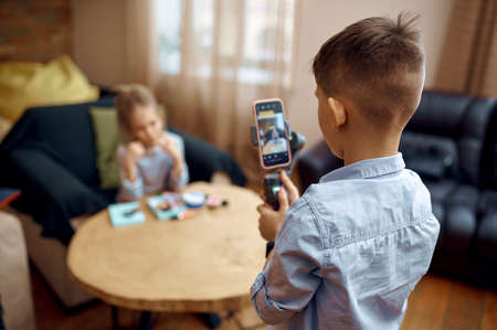 Two children bloggers records blog on camera