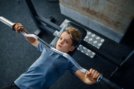 Boy on exercise machine, top view