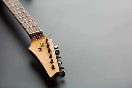 Electric guitar, closeup view on head