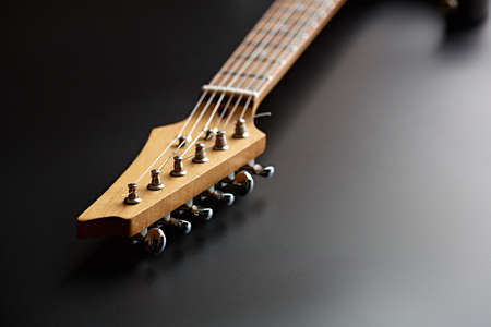Electric guitar, closeup view on head