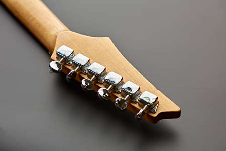 Electric guitar, closeup view on head