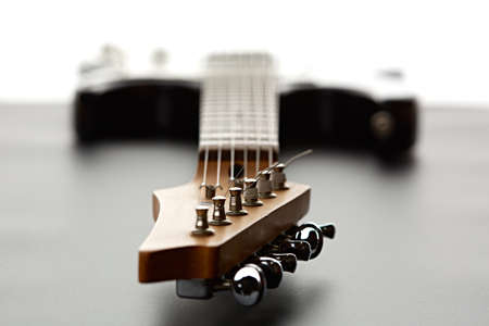 Electric guitar, fosuc view on head, closeup