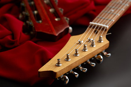 Electric and classical acoustic guitar headsの写真素材