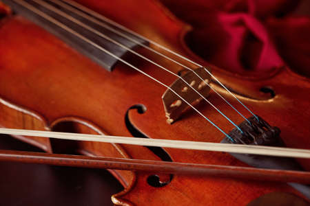 Violin in retro style and bow, closeup view