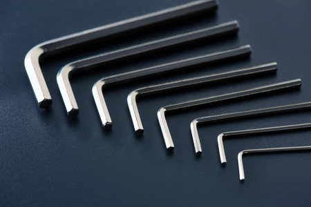 Set of hexagonal bits, closeup, grey backgroundの写真素材