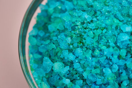 Blue sea salt in glass bowl, closeup view