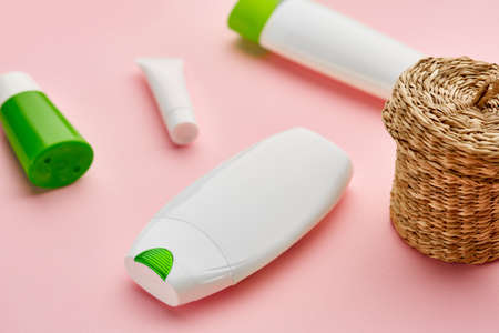 Skin care products, macro view, pink background