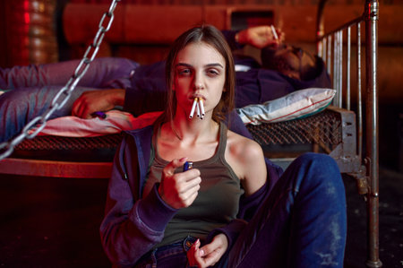 Drug addicts smokes a cigarette while highの写真素材