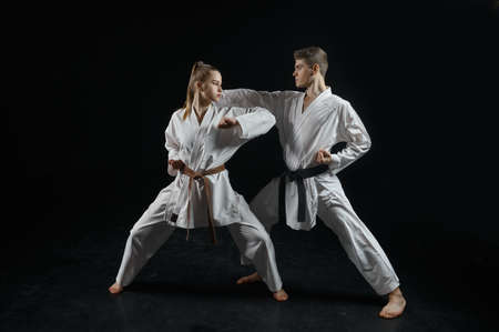 Female karate fighter on training with masterの写真素材