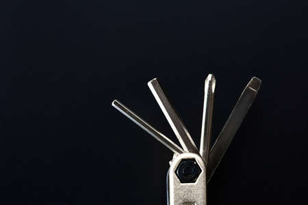 Folding screwdriver with different bits, closeupの写真素材