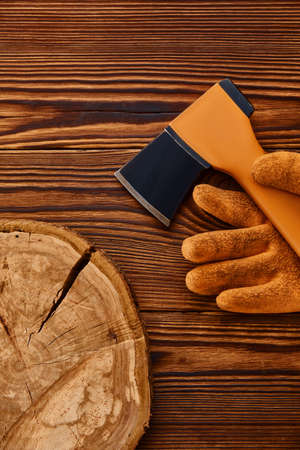 Axe and gloves on wooden background, nobodyの写真素材