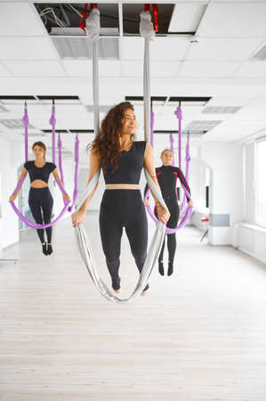 Fly yoga studio, hanging on hammocks, antigravity