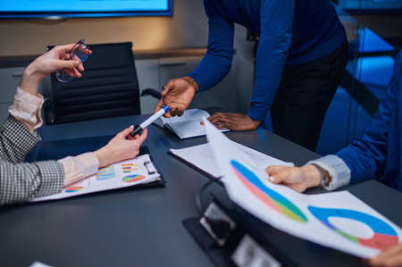 Managers on business negotiations in night office