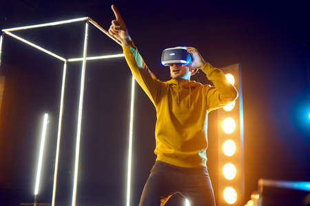 Gamer plays simulator in virtual reality headset