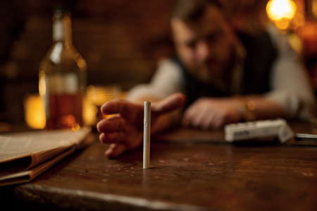 Drunk man tries to take a cigarette