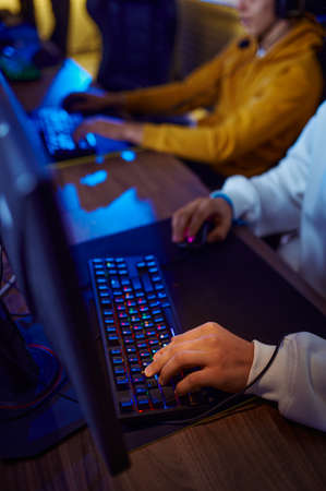 Two young gamers play in game clubの写真素材
