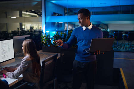 Two managers works in night officeの写真素材